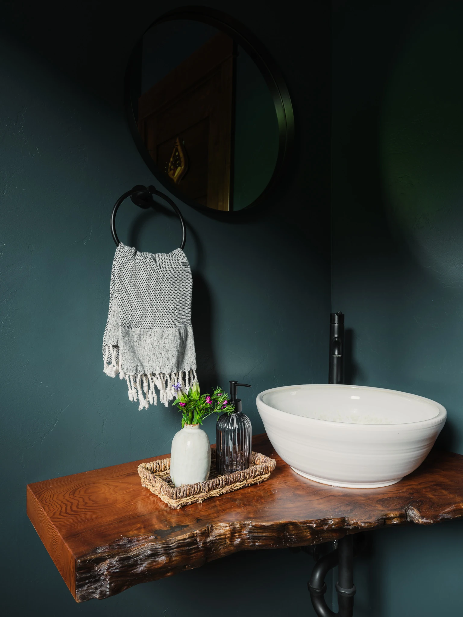 Powder room with a live-edge wood vanity and round vessel sink — interior design photography Livingston Montana, Bear Canyon Ranch